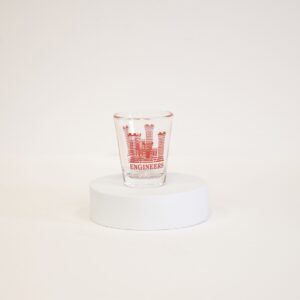 A small one ounce clear glass shot glass has anArmy Engineer castle logo with "Engineers" written below the castle design.