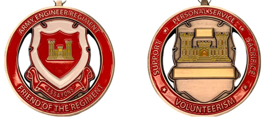 The front and backsides of the Friend of the Regiment Award from the Army Engineer Association. The front features the regimental crest with "Friend of the Regiment on the outer ring" The back has a castle with 'Support. Personal Service, Sacrifice and Volunteerism" around the outer circle.